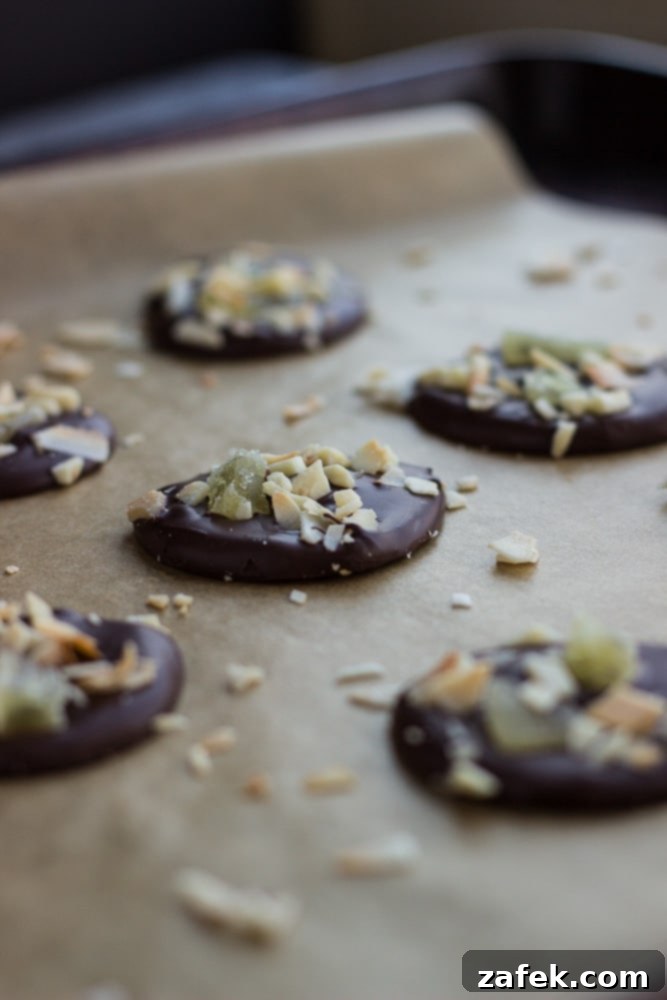 A close-up shot of elegant Christmas Mendiants, highlighting their varied textures and festive toppings, perfect for holiday gatherings.