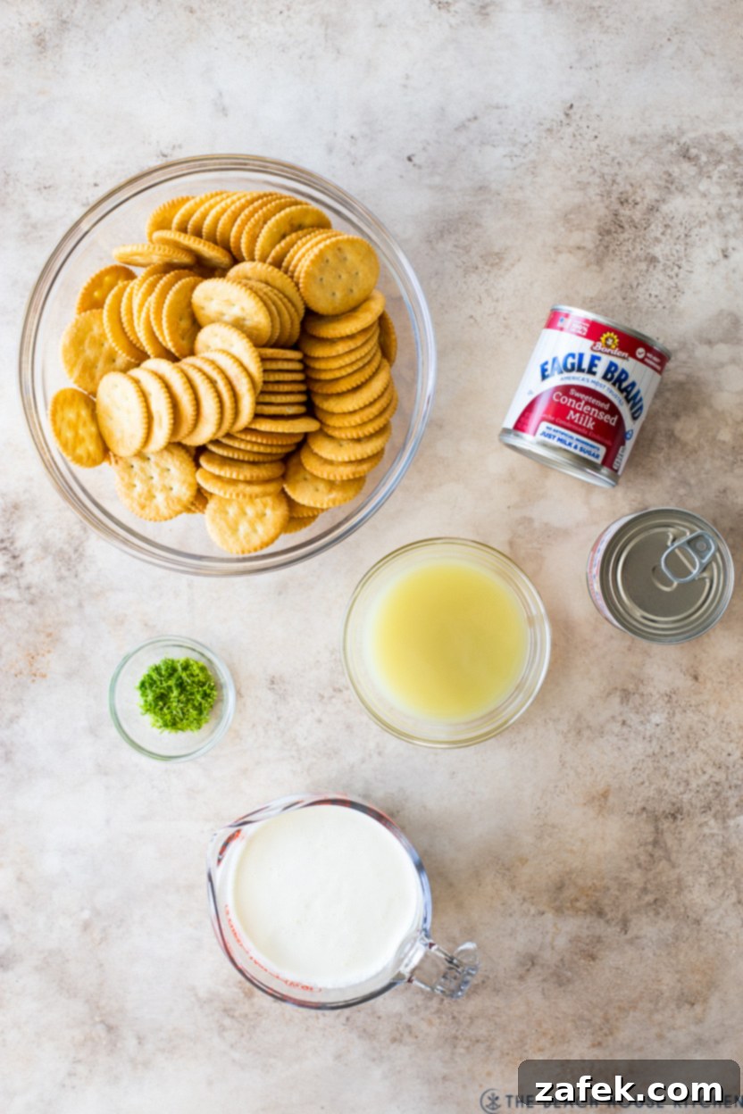Overhead photo of ingredients for a key lime pie with crackers laid out on a table
