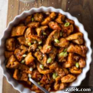 Crispy Gochujang Chicken Stir-Fry 10 Stir-Fried Gochujang Chicken in a serving dish, ready to eat.