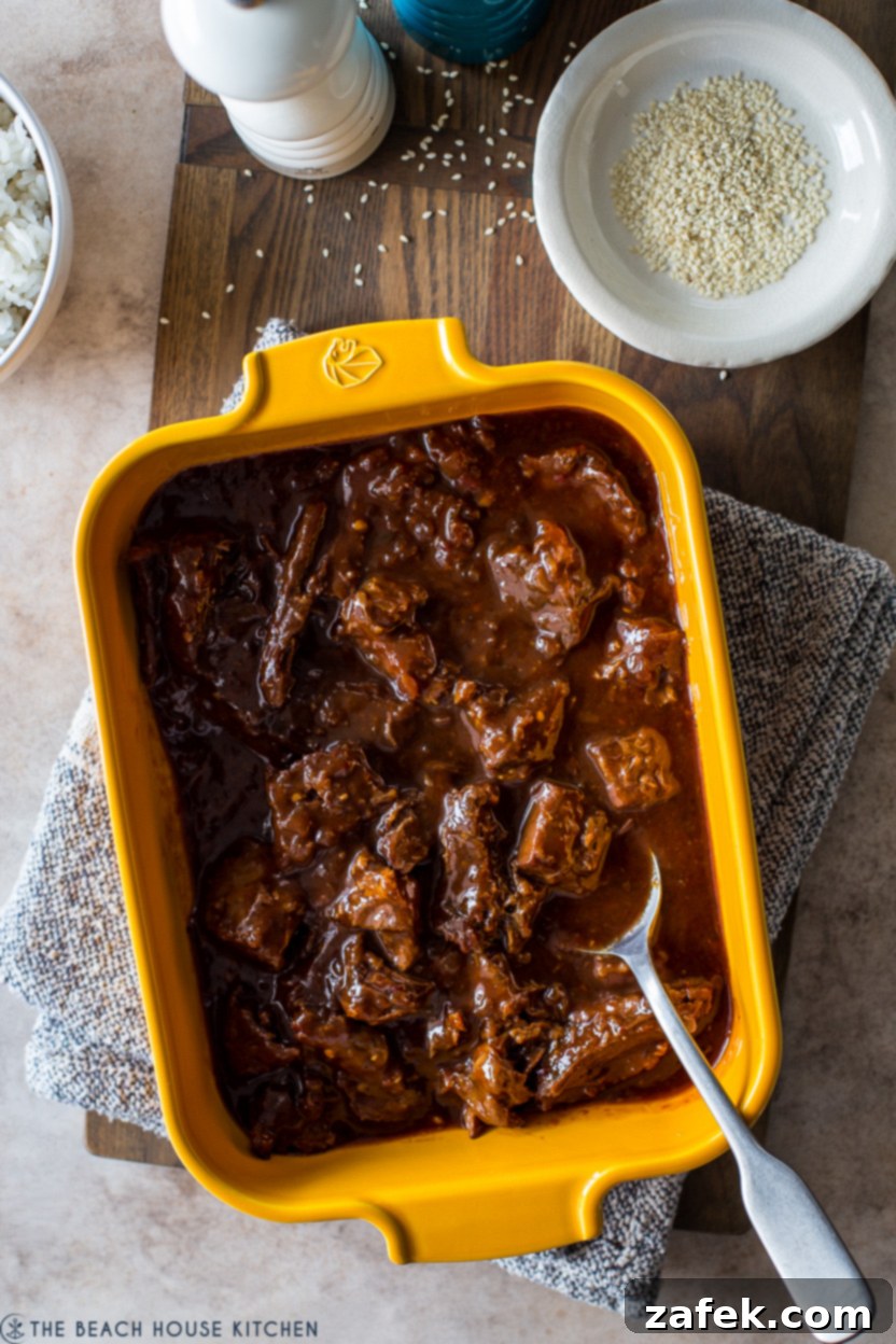 Up close overhead photo of Korean Style Pot Roast in a mustard yellow baking dish