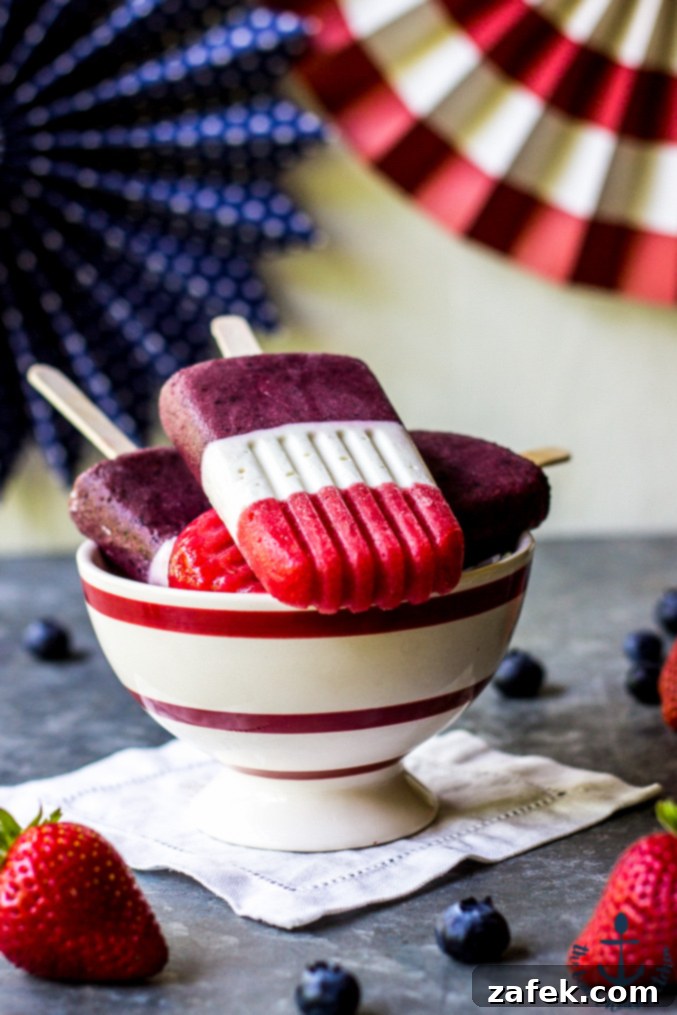 4th of July Berry Cheesecake Popsicles - A festive and delicious summer treat.