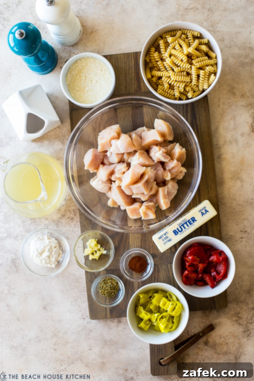 Overhead photo of ingredients for pepperoncini chicken pasta dish arranged on a counter