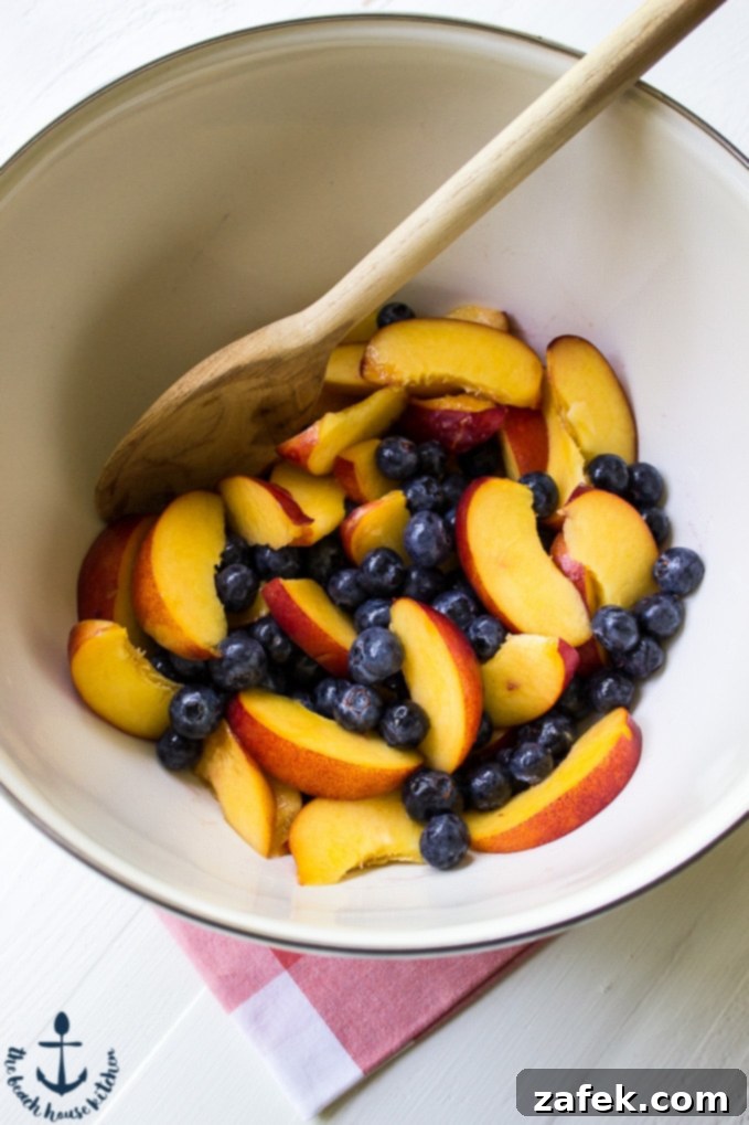 Assembling Gluten Free Blueberry Nectarine Crisp