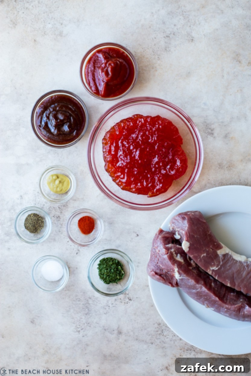 Overhead photo of ingredients for a slow cooker pork tenderloin, including jars of sauces and spices.