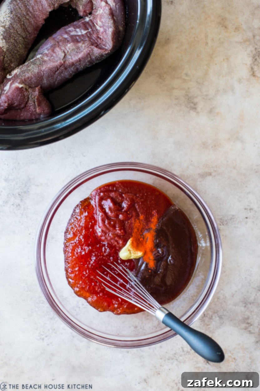 Overhead photo of glaze ingredients for a pork tenderloin, being whisked in a bowl.