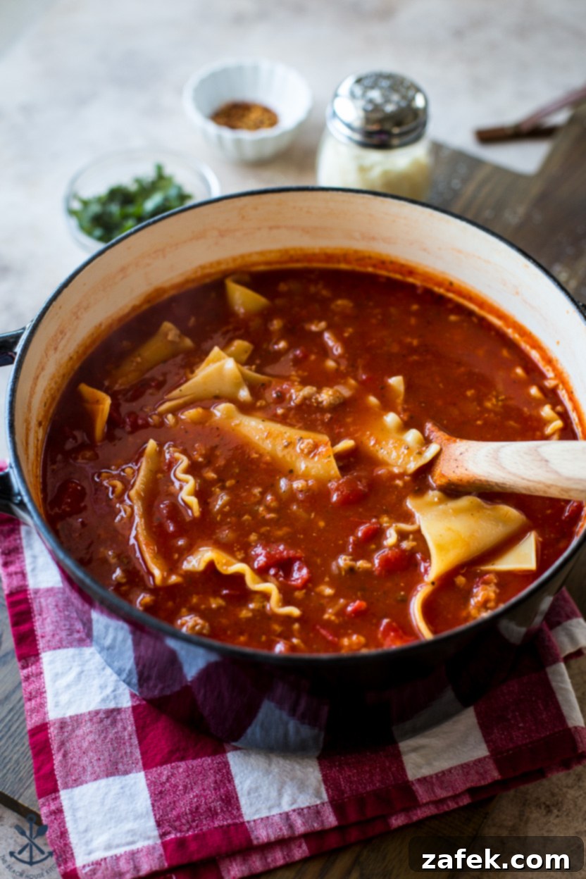 Hearty Lasagna Soup 3 A large pot of bubbling lasagna soup on a stove
