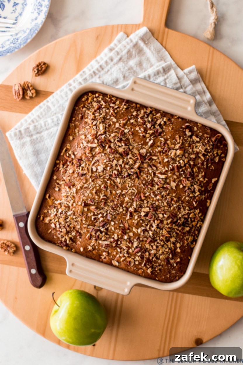 Overhead photo of a an apple spice snack cake, perfectly golden brown and inviting