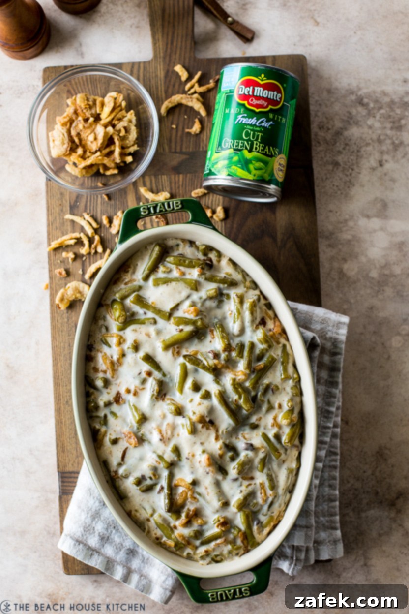 Overhead photo of a baked green bean casserole bubbling in the dish