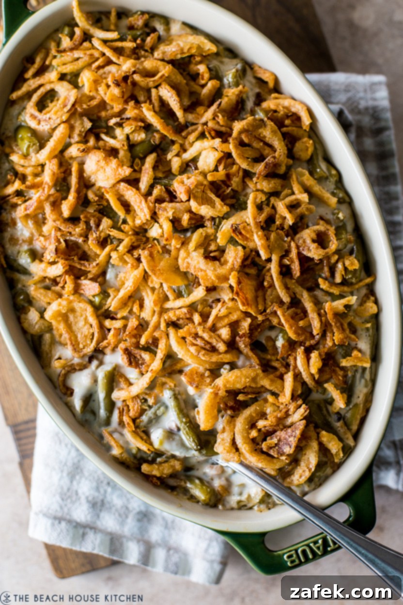 Up close overhead photo of a French onion topped green bean casserole, golden brown and crispy