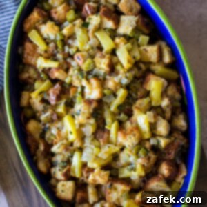 Golden Pineapple Stuffing 11 A perfectly golden brown oval dish of Pineapple Stuffing, beautifully presented and ready to be served for a holiday meal