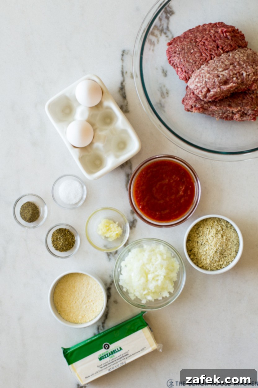 Overhead photo of fresh ingredients for an Italian meatloaf laid out on a counter, ready for preparation.