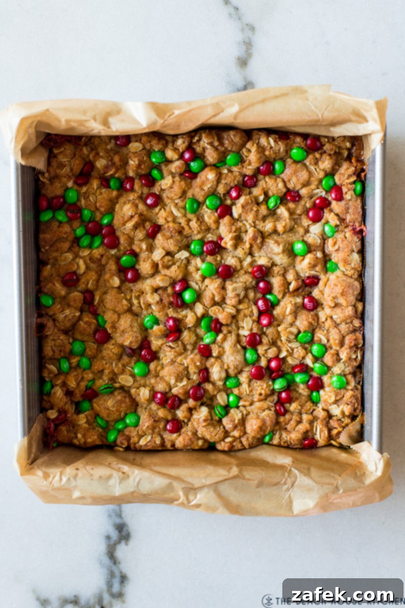 Effortless Carmelita Squares 2 Overhead photo of an 8x8 pan of easy carmelitas, cut into squares, showcasing gooey caramel and chocolate chips