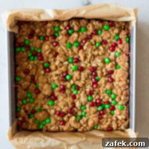 Effortless Carmelita Squares 12 Easy Carmelitas bars cut into squares on a white background