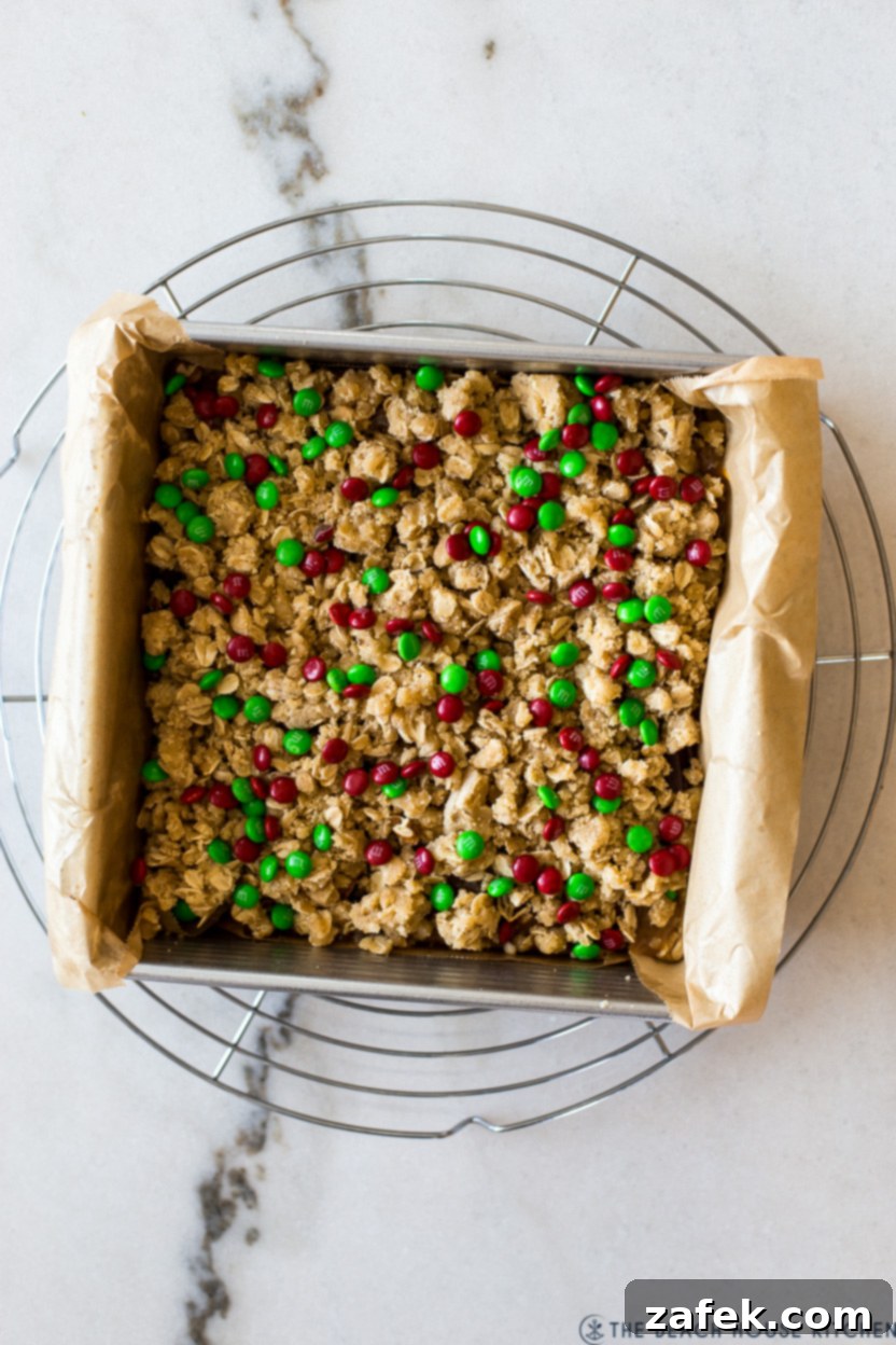 Effortless Carmelita Squares 9 Overhead photo of pre-baked carmelitas bars, showing the topping before cooling