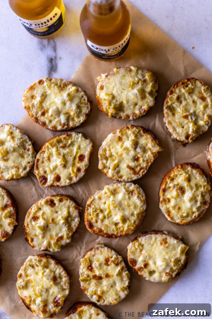 Whispers of Josephina 2 Overhead photo of golden-brown Josephinas on parchment paper, ready to be served, with two refreshing beverages in the background.