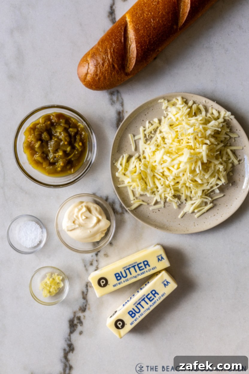 Whispers of Josephina 4 Overhead photo of all the simple ingredients laid out for Josephinas: butter, Monterey Jack cheese, garlic, mayonnaise, diced green chiles, kosher salt, and a French baguette.