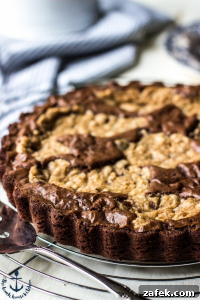 Decadent Peanut Butter Chocolate Chip Brookie Tart 4 Peanut Butter Brookie Tart ready to be sliced