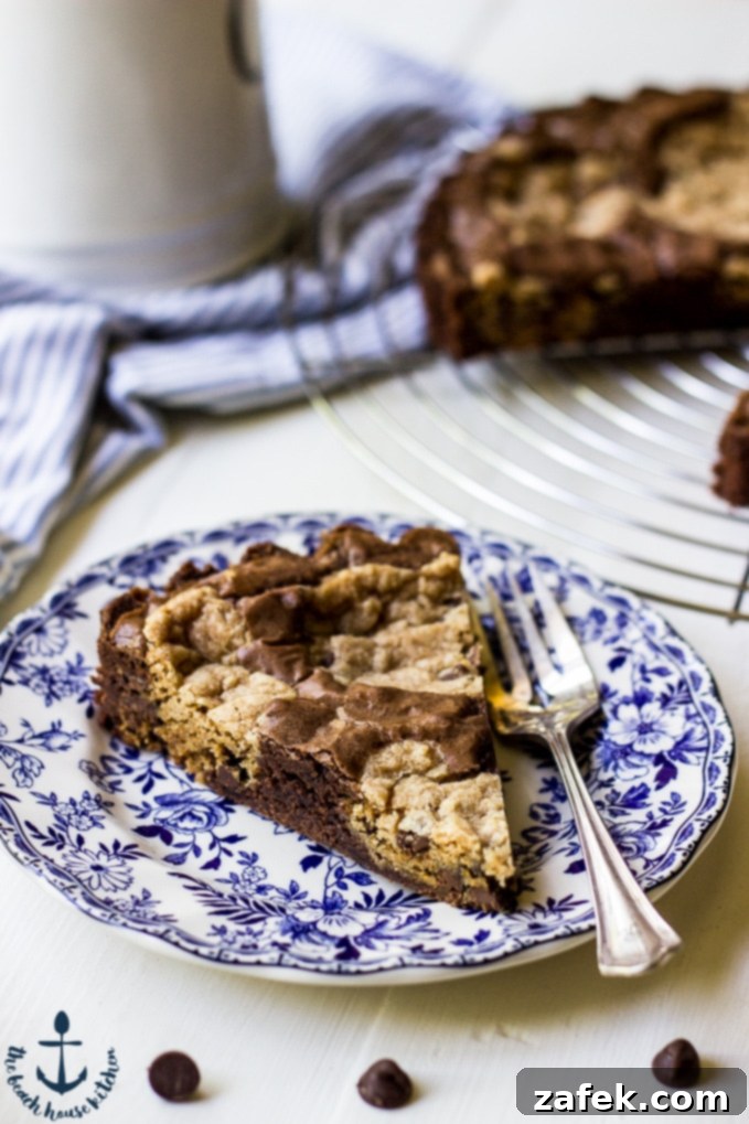 Decadent Peanut Butter Chocolate Chip Brookie Tart 5 A slice of Peanut Butter Chocolate Chip Brookie Tart on a plate