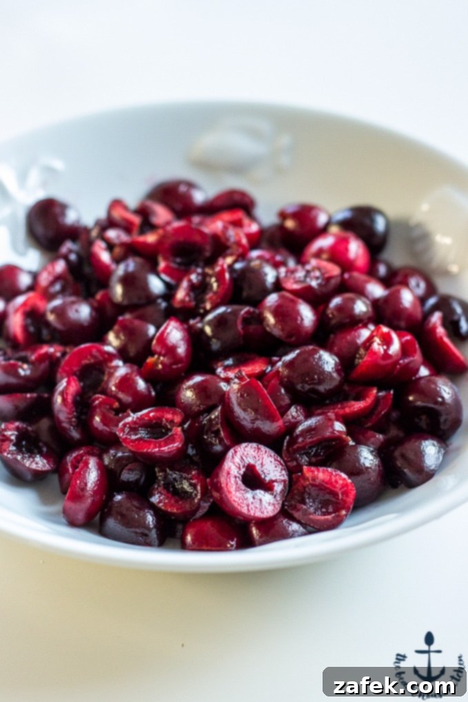 Zesty Lemon Poppy Seed Pancakes with Ruby Cherry Compote 3 Close-up of golden Lemon Poppyseed Pancakes stacked high, drizzled with thick, glistening Cherry Compote.