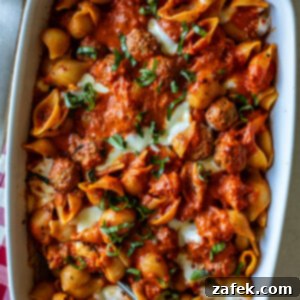Delicious Meatball Pasta Bake with golden melted cheese and fresh basil