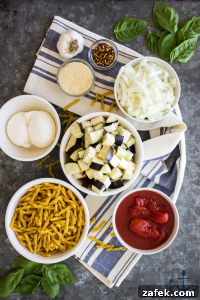 Sweet and Savory Burrata Pasta with Eggplant and Caramelized Onion 3 Close-up of Eggplant, Caramelized Onion, Tomato and Burrata Pasta, showcasing the creamy burrata