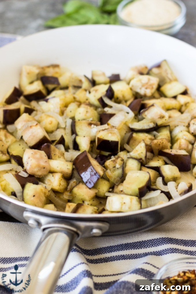 Sweet and Savory Burrata Pasta with Eggplant and Caramelized Onion 6 Overhead shot of Eggplant, Caramelized Onion, Tomato and Burrata Pasta in a large bowl