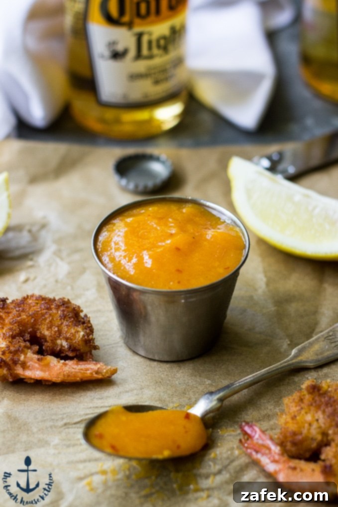 Mango Chipotle Glazed Popcorn Shrimp 3 Close-up of golden-brown Popcorn Shrimp arranged elegantly