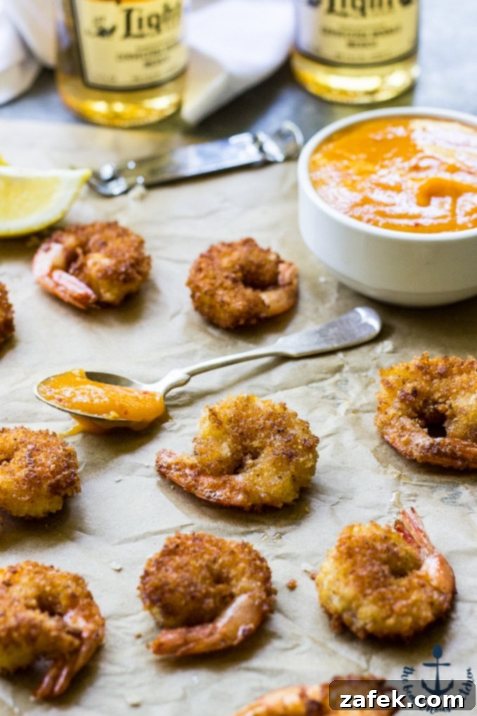 Mango Chipotle Glazed Popcorn Shrimp 4 Crispy Popcorn Shrimp perfectly golden brown on a serving platter