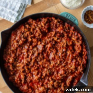Rustic Italian Meat Grinders 8 Close-up of a serving of Italian Sloppy Joes on a bun