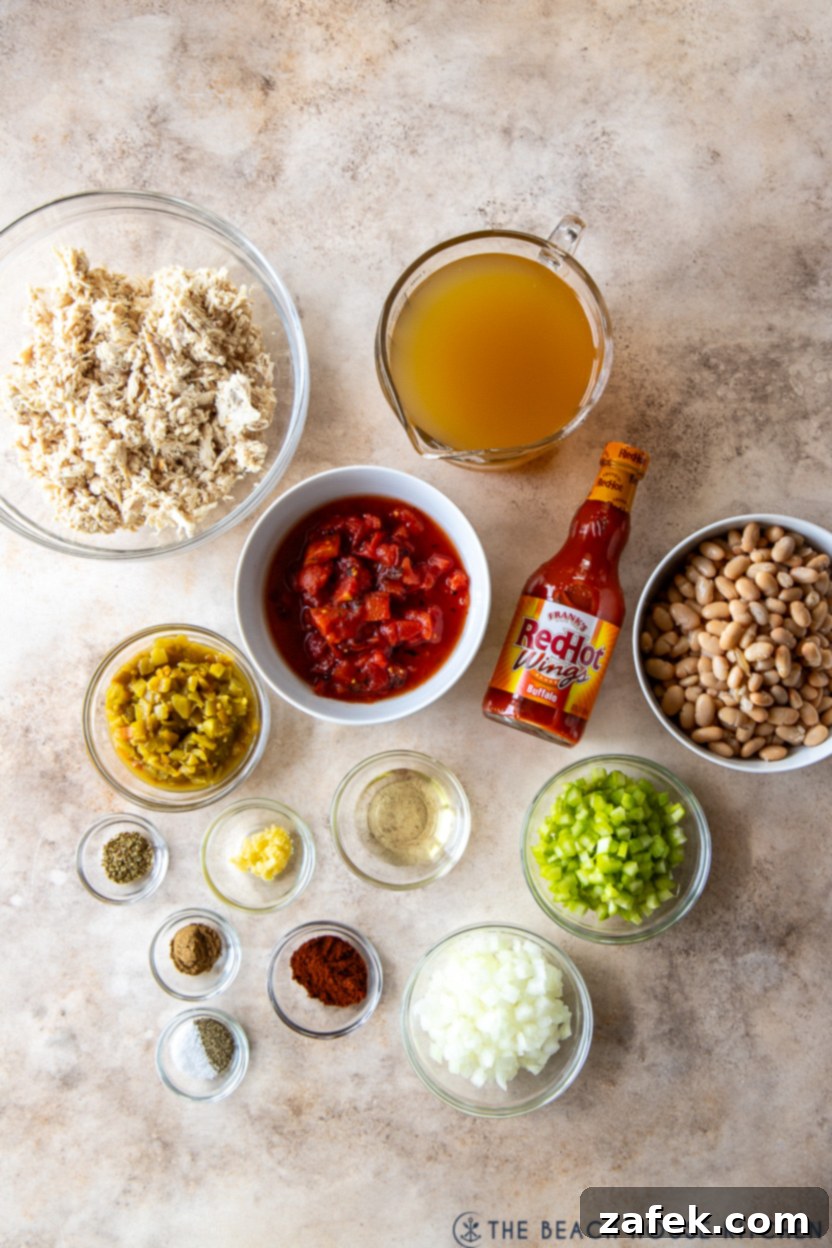 Overhead photo of fresh ingredients for buffalo chicken chili laid out on a cutting board