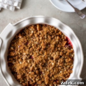 Spiced Apple Cranberry Crisp 12 A warm Apple Cranberry Crisp, golden brown and bubbly, in a pie dish