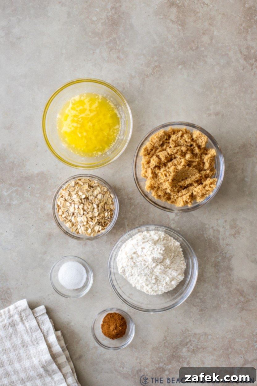 Spiced Apple Cranberry Crisp 4 Overhead photo of ingredients for the crisp topping: flour, oats, brown sugar, cinnamon, salt, and melted butter